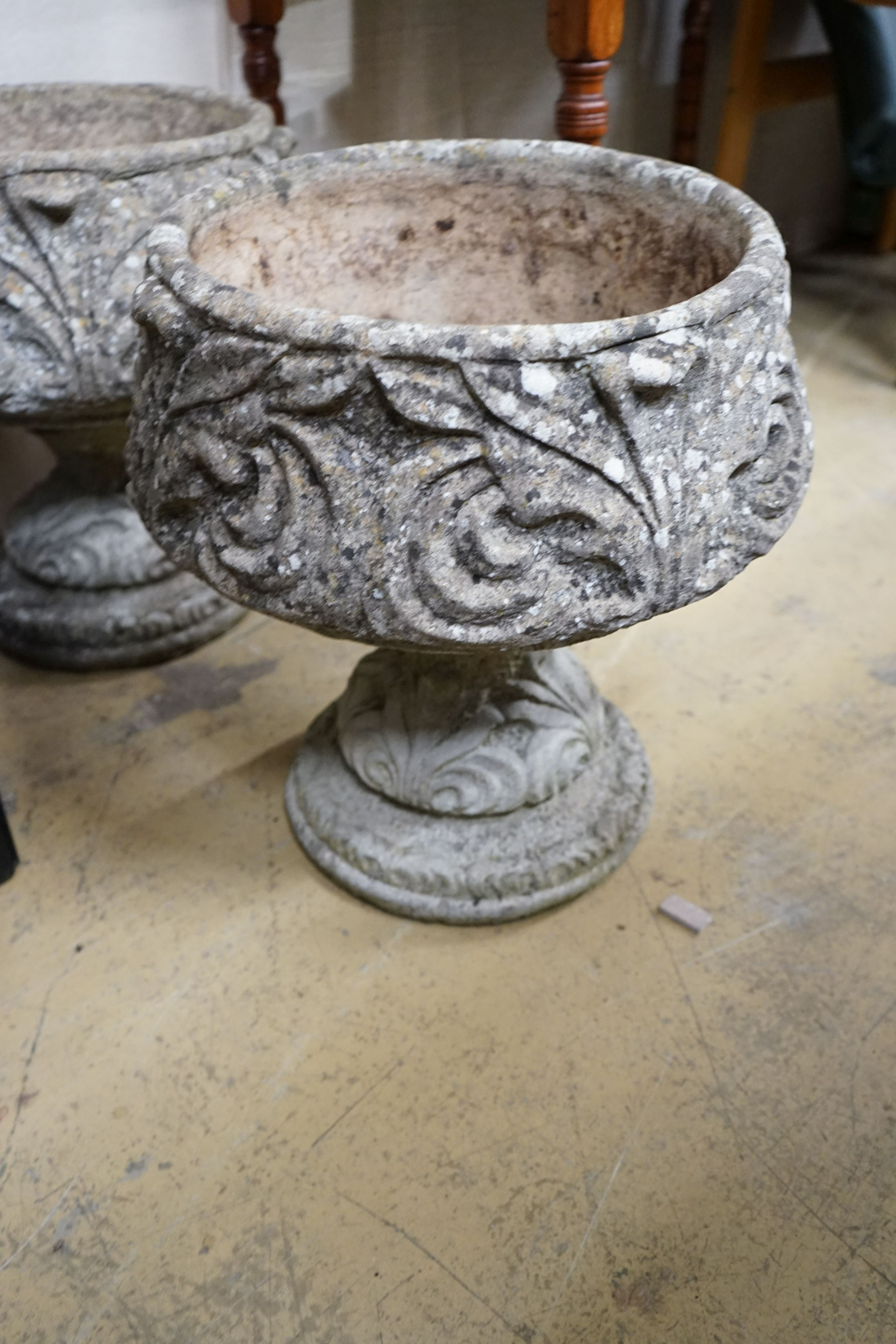 A pair of reconstituted stone circular garden planters, diameter 45cm, height 48cm